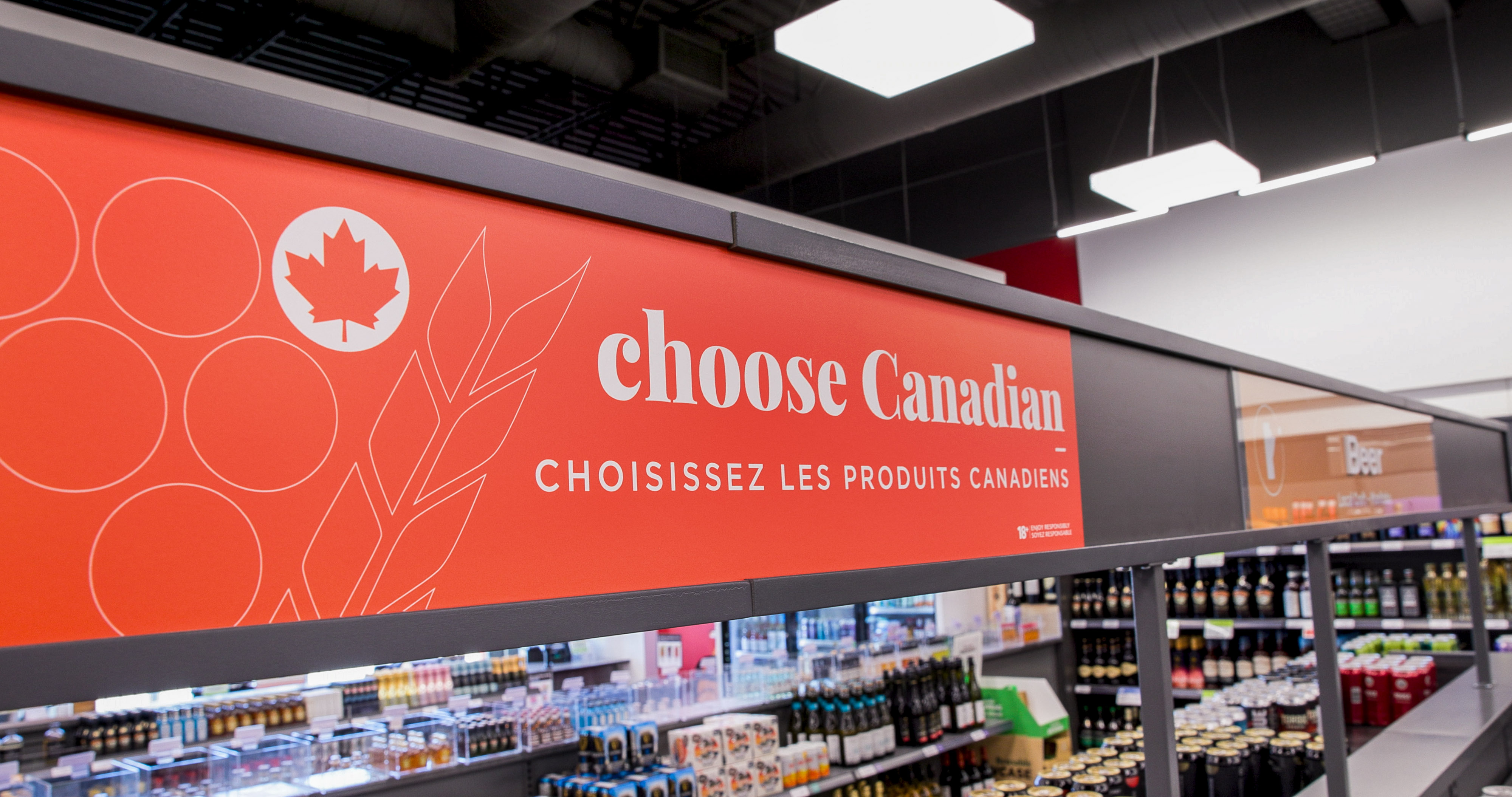 Liquor Mart craft beer aisle, Choose Canadian sign